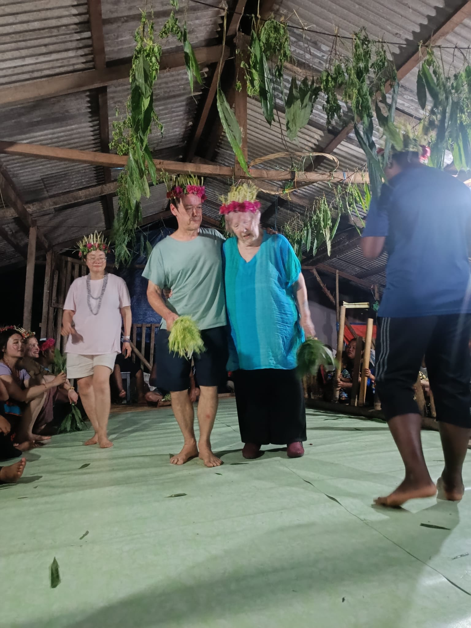 Sue and Andy taking part in a gabag ritual in Malaysia