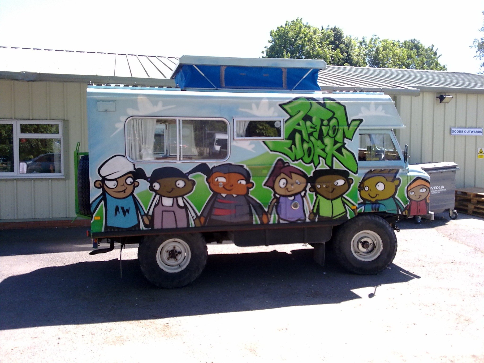 Actionwork vehicle decorated with colourful figures and lettering
