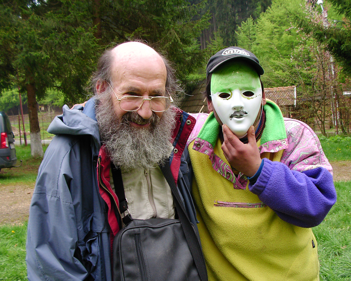Peter with a workshop participant holding a mask outdoors